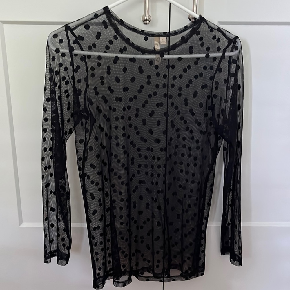 Sheer long sleeve polka dot top.